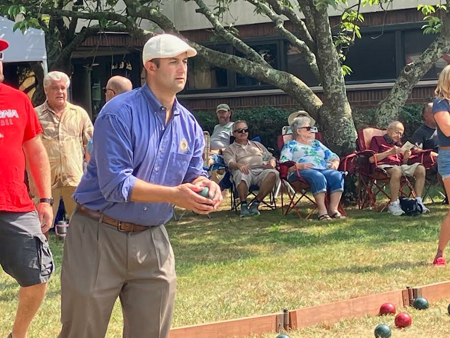 Rob Calarco, 2023 Italian-American of the Year, tosses a bocce ball during a tournament outside Carnegie Library.
